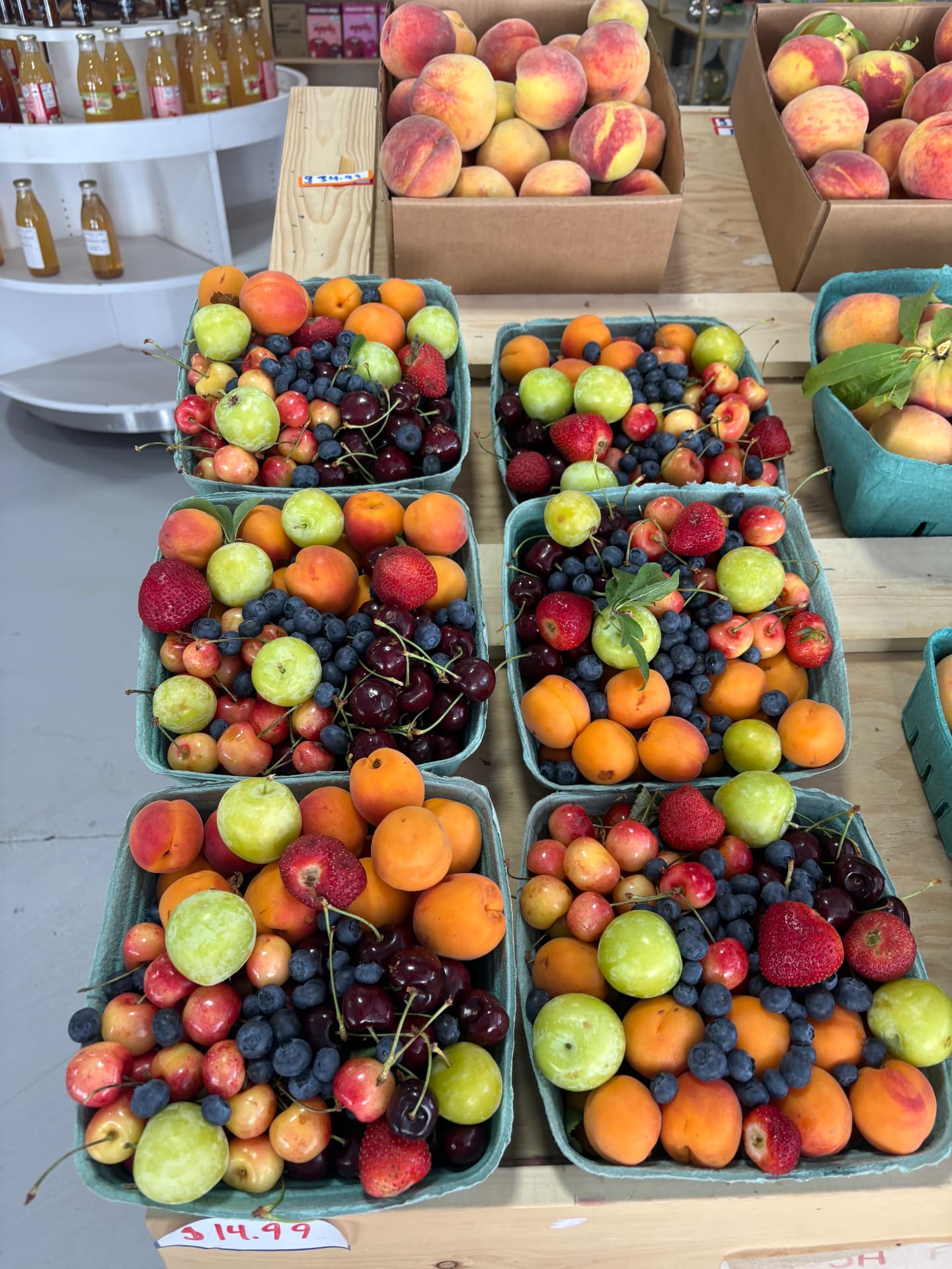 Mixed fruit baskets with apricots, cherries, blueberries and strawberries